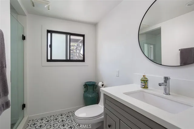 a view of a house with a flower garden