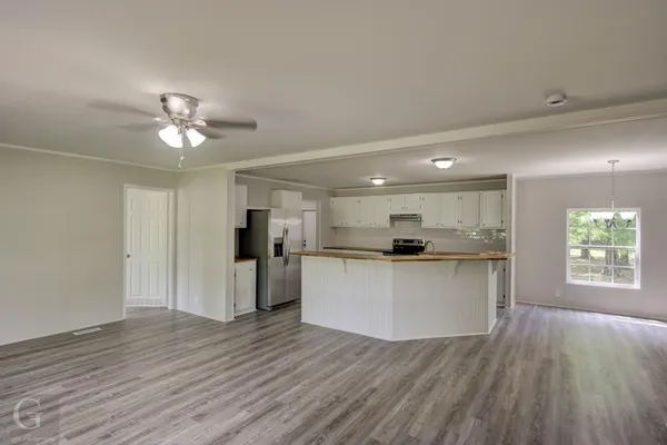 a view of a large yard with lots of trees