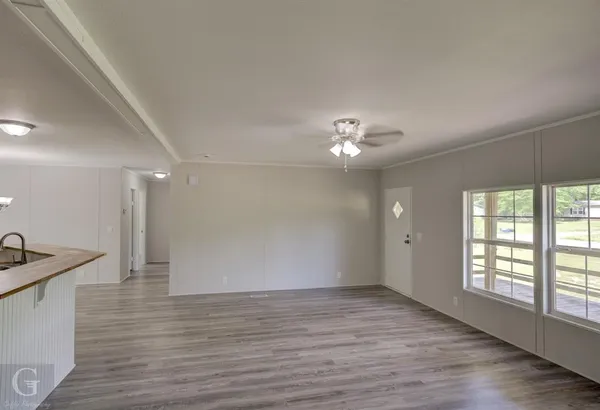 a kitchen with a refrigerator and a sink