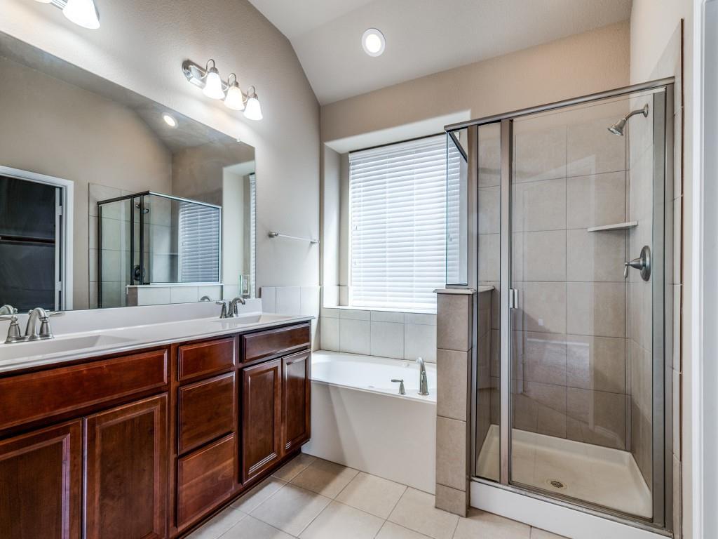 11608 Netleaf Lane Fort Worth, TX 76244 - Photo 11 of 12 a bathroom with a double vanity sink mirror and shower