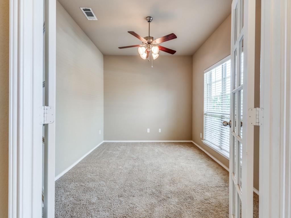 11608 Netleaf Lane Fort Worth, TX 76244 - Photo 2 of 12 an empty room with chandelier fan and windows