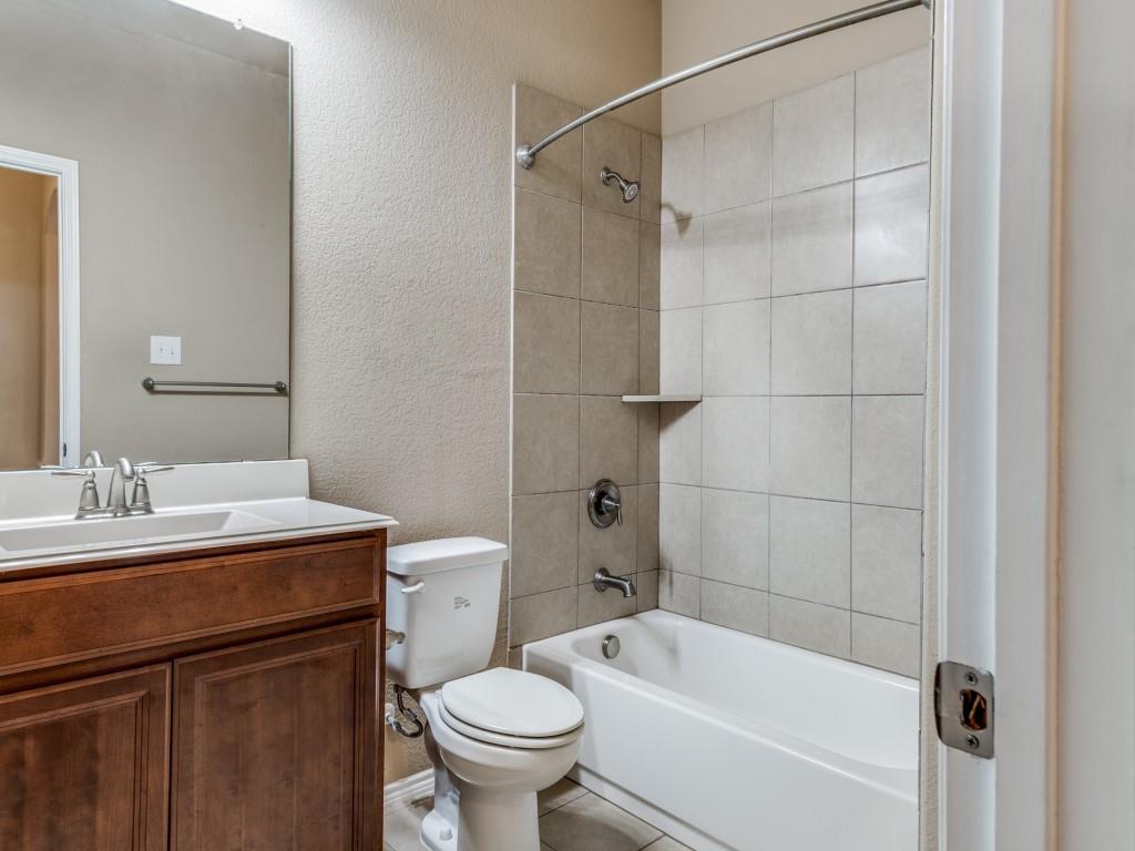 11608 Netleaf Lane Fort Worth, TX 76244 - Photo 8 of 12 a bathroom with a sink toilet and shower