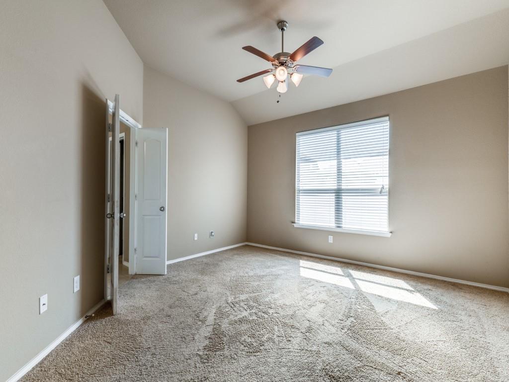 11608 Netleaf Lane Fort Worth, TX 76244 - Photo 10 of 12 an empty room with chandelier fan and windows