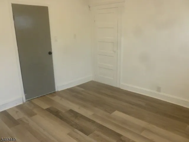 a view of a small space with wooden floor