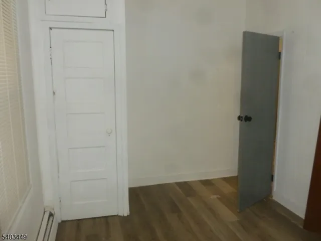 an empty room with wooden floor