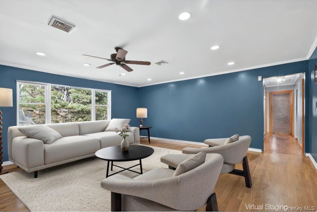 91 Meyerhoff Road Hurleyville, NY 12747 - Photo 12 of 43 a living room with furniture and a large window