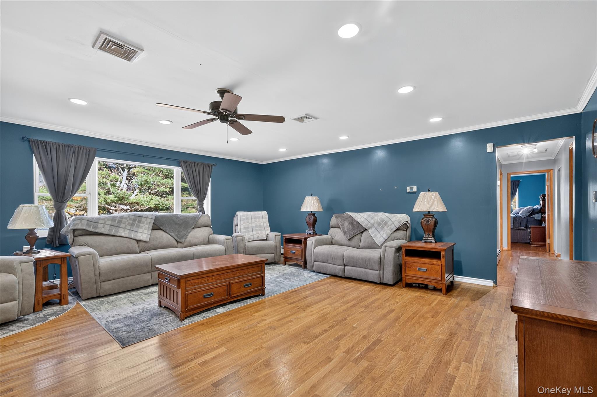 91 Meyerhoff Road Hurleyville, NY 12747 - Photo 13 of 43 a living room with furniture and a ceiling fan