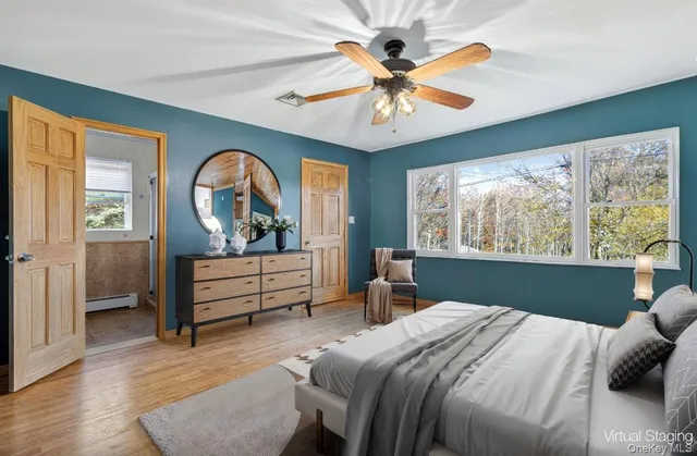 a bedroom with a bed and a mirror