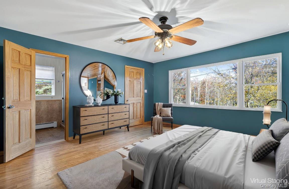 91 Meyerhoff Road Hurleyville, NY 12747 - Photo 14 of 43 a bedroom with a bed and a mirror