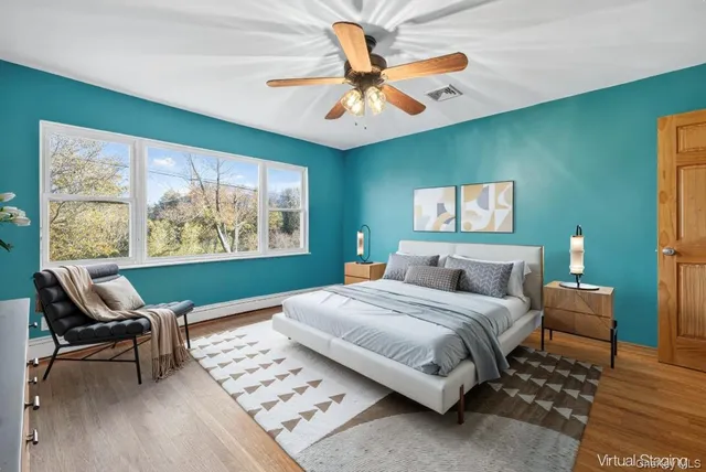 a bedroom with a bed furniture and a window