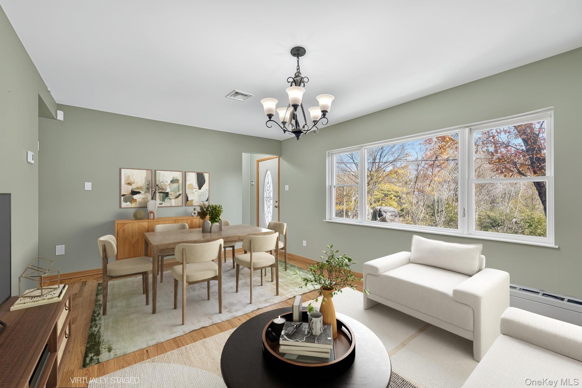 91 Meyerhoff Road Hurleyville, NY 12747 - Photo 2 of 43 a living room with furniture and a large window