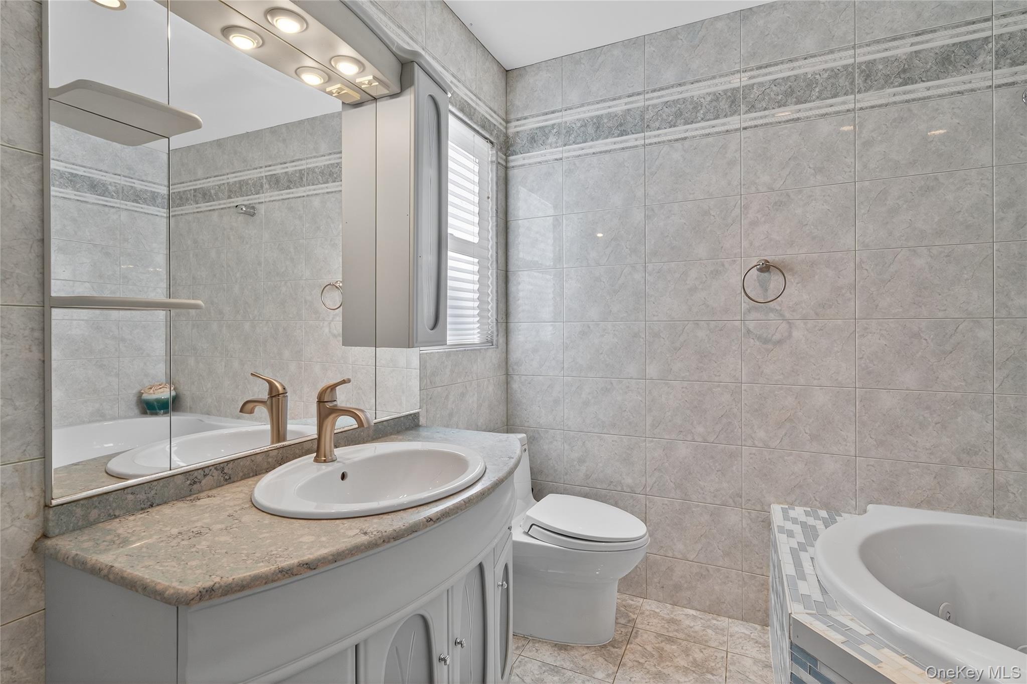 91 Meyerhoff Road Hurleyville, NY 12747 - Photo 21 of 43 a bathroom with a sink and mirror