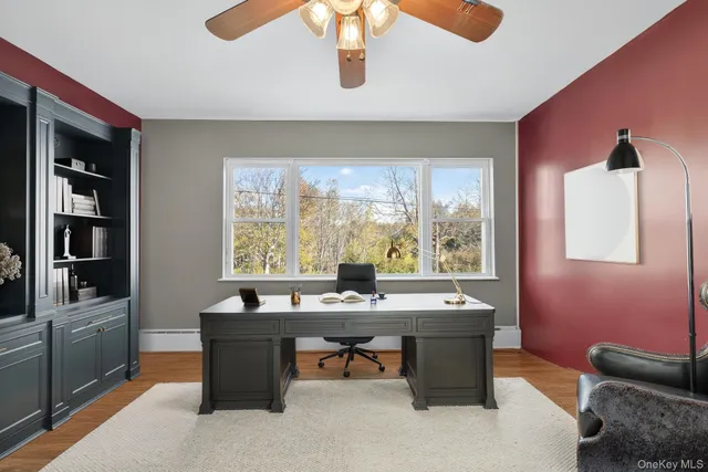 a room with furniture pool table and window