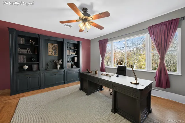 a room with pool table and windows