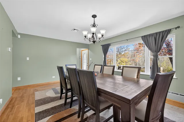 a view of a dining room with furniture window and outside view