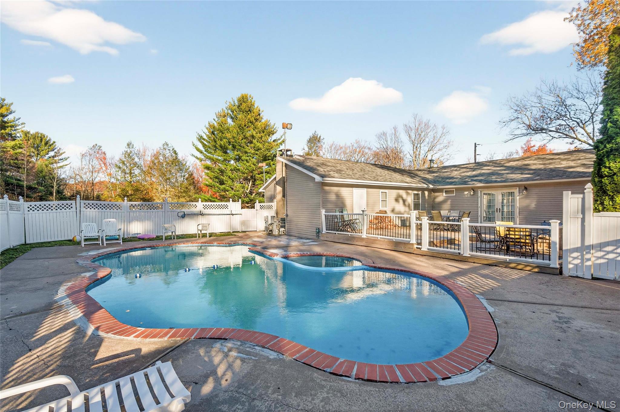 91 Meyerhoff Road Hurleyville, NY 12747 - Photo 31 of 43 a view of a swimming pool with a lounge chairs