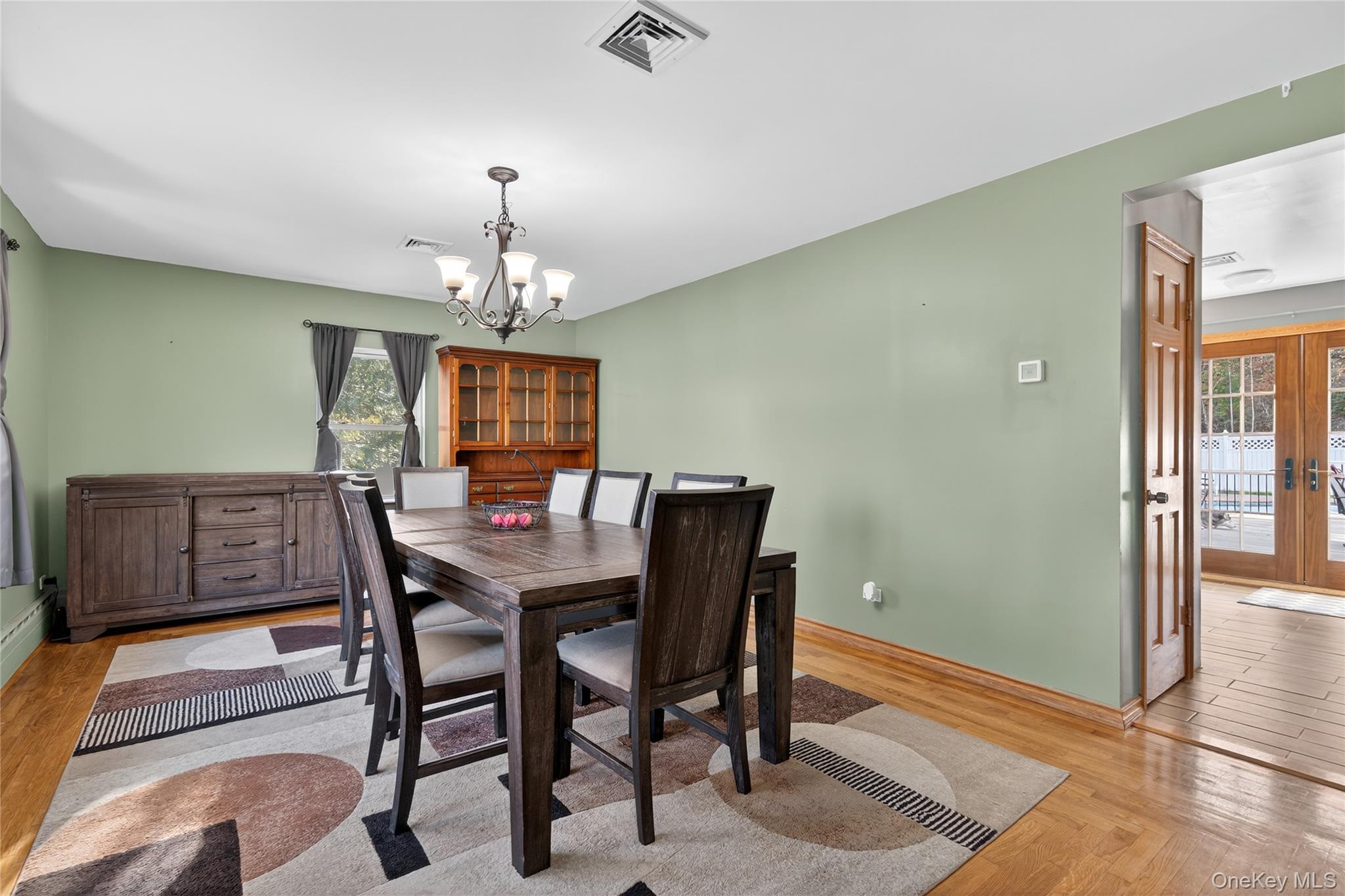91 Meyerhoff Road Hurleyville, NY 12747 - Photo 7 of 43 a view of a dining room with furniture window and wooden floor