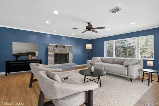 a living room with furniture and a fireplace