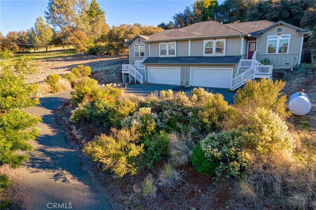 10401 Point Lakeview Road Kelseyville, CA 95451 - Photo 3 of 41 a house with swimming pool in front of it