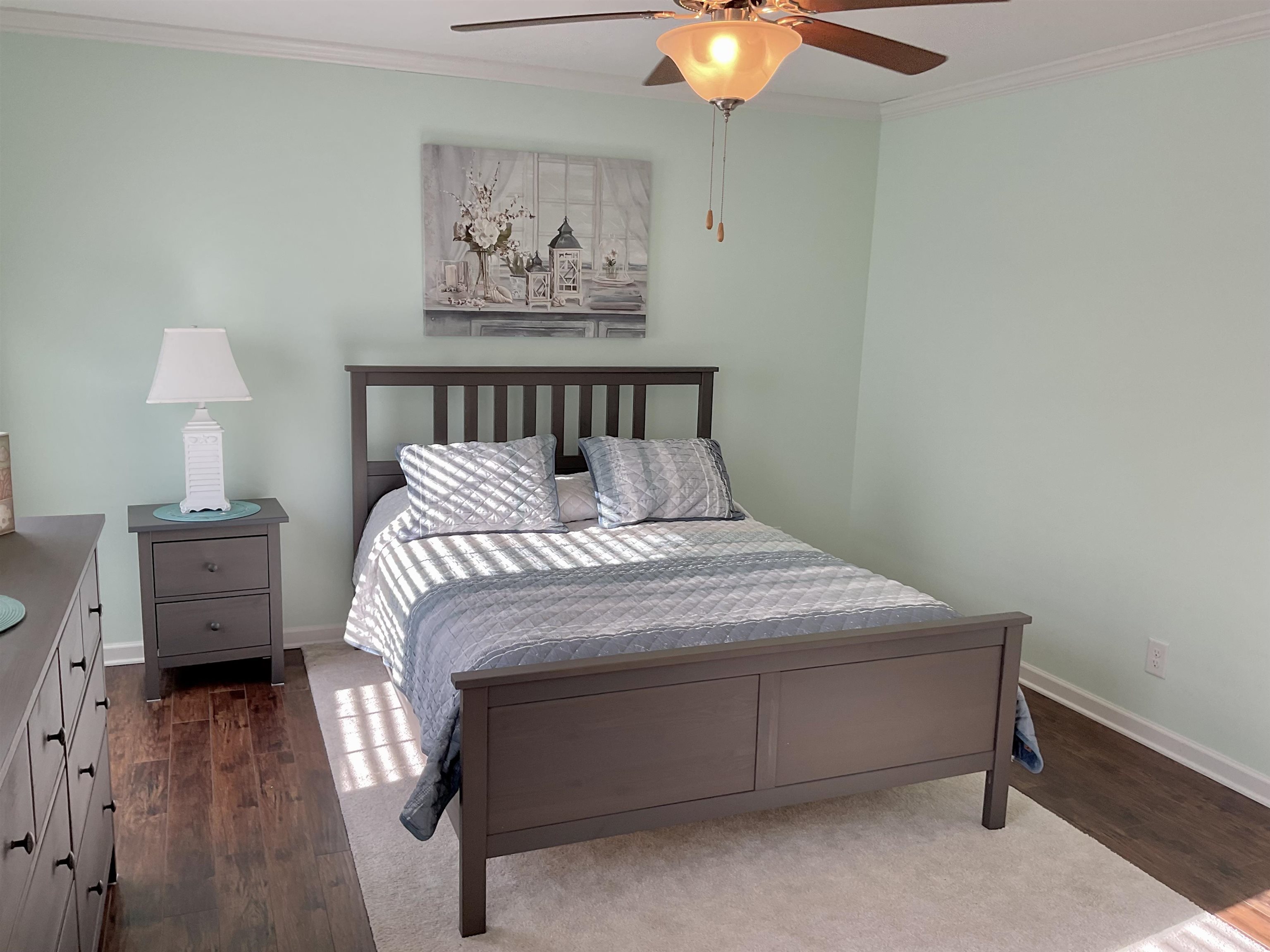 2058 Shore Road Seaville, NJ 08230 - Photo 23 of 36 a bedroom with a bed and a chandelier