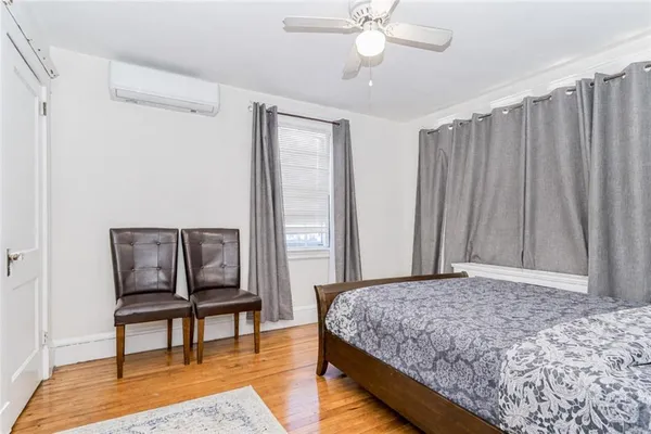 a bedroom with a bed a table and chair