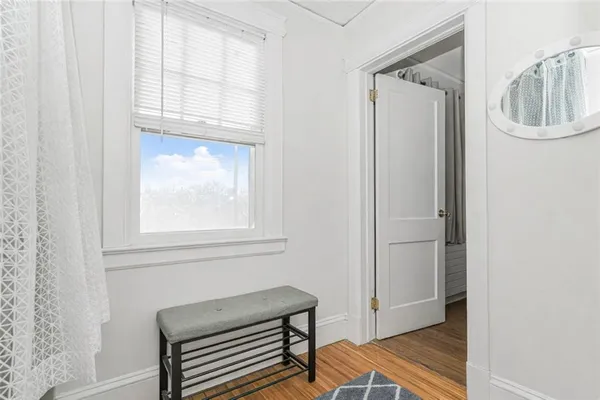 a view of room with window and hallway