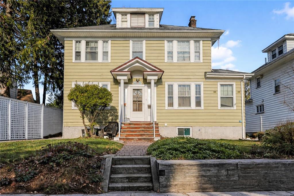 119 Watchogue Road Staten Island, NY 10314 - Photo 2 of 26 a front view of a house with a yard