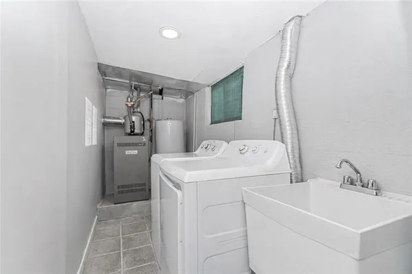 a utility room with dryer and washer