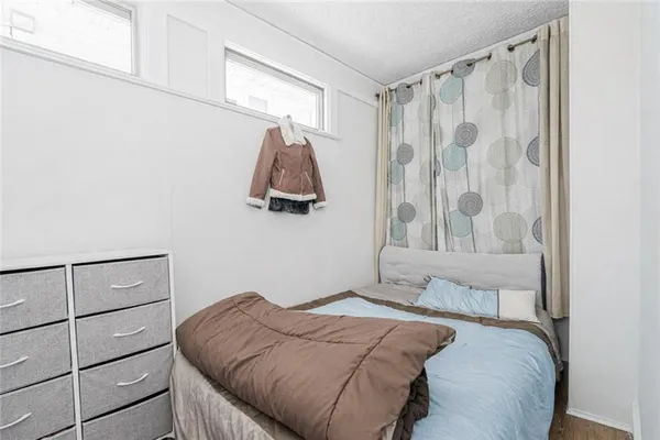 a bedroom with a bed and a walk in closet