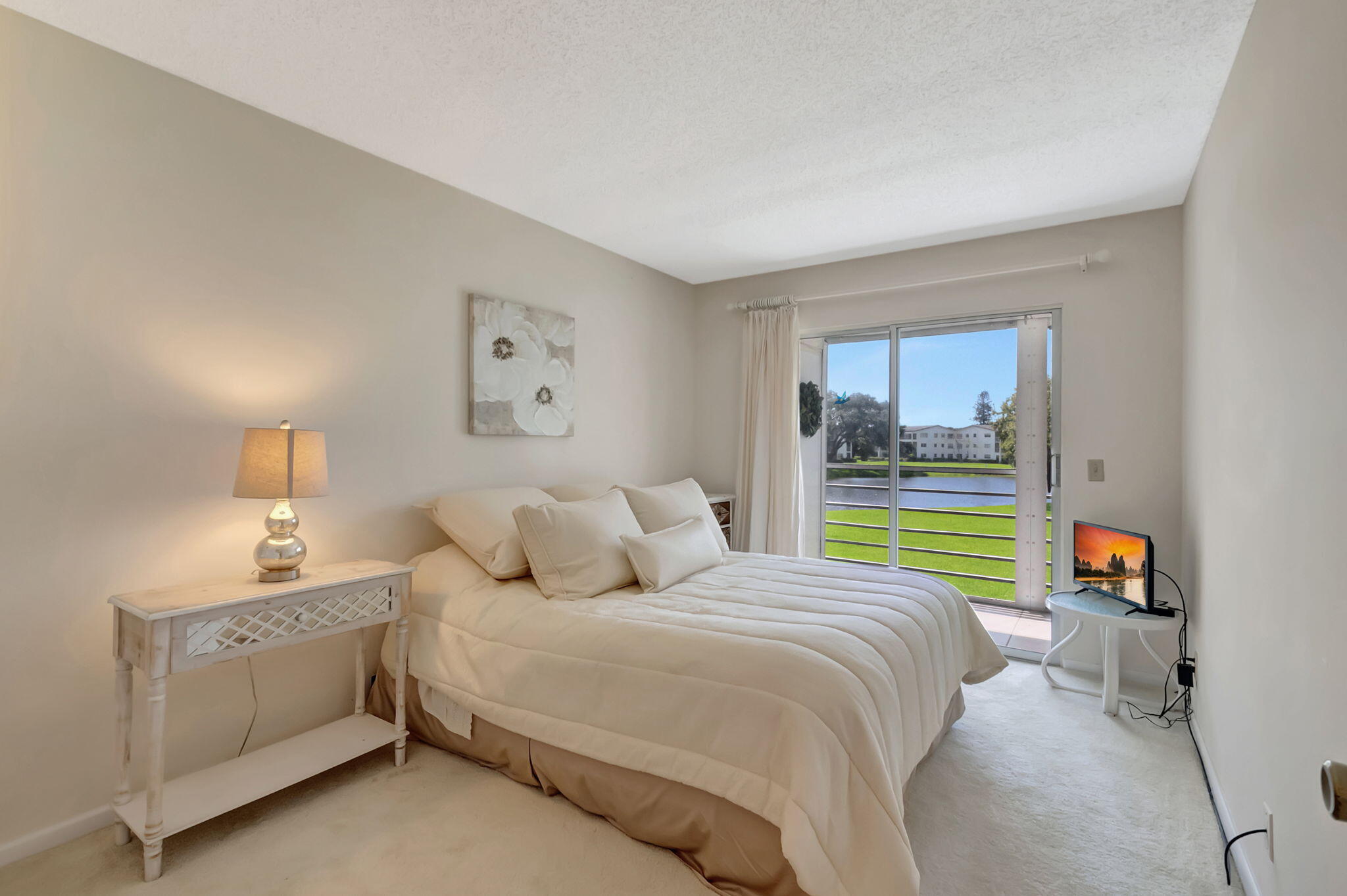 28 Fanshaw A Boca Raton, FL 33434 - Photo 12 of 63 a bedroom with a bed and a window