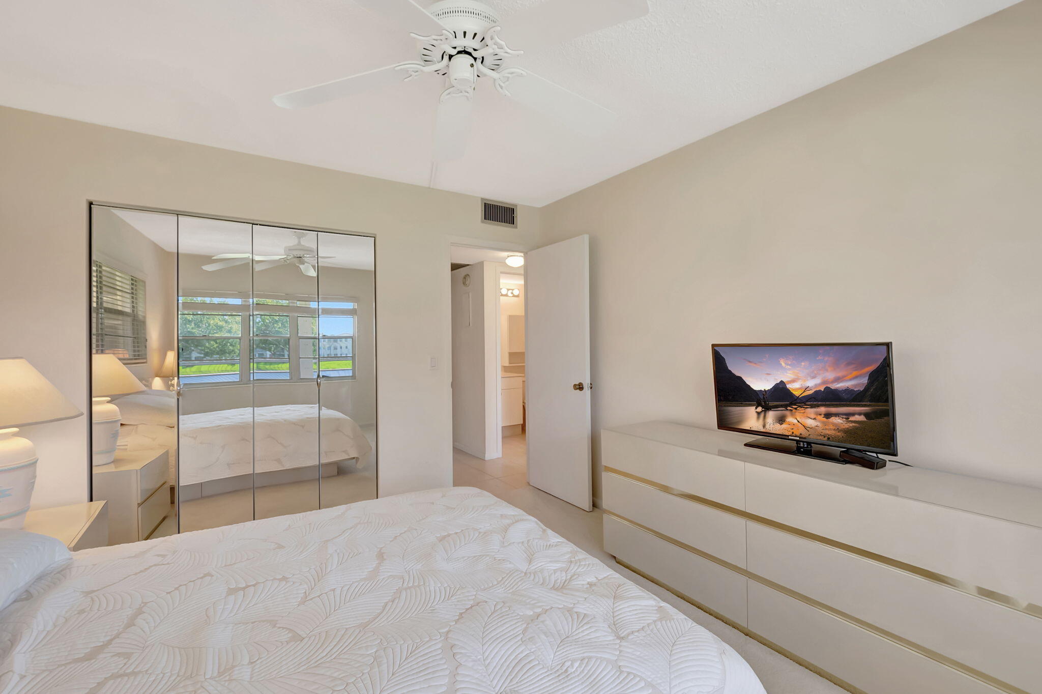 28 Fanshaw A Boca Raton, FL 33434 - Photo 15 of 63 a bedroom with a bed and a large window