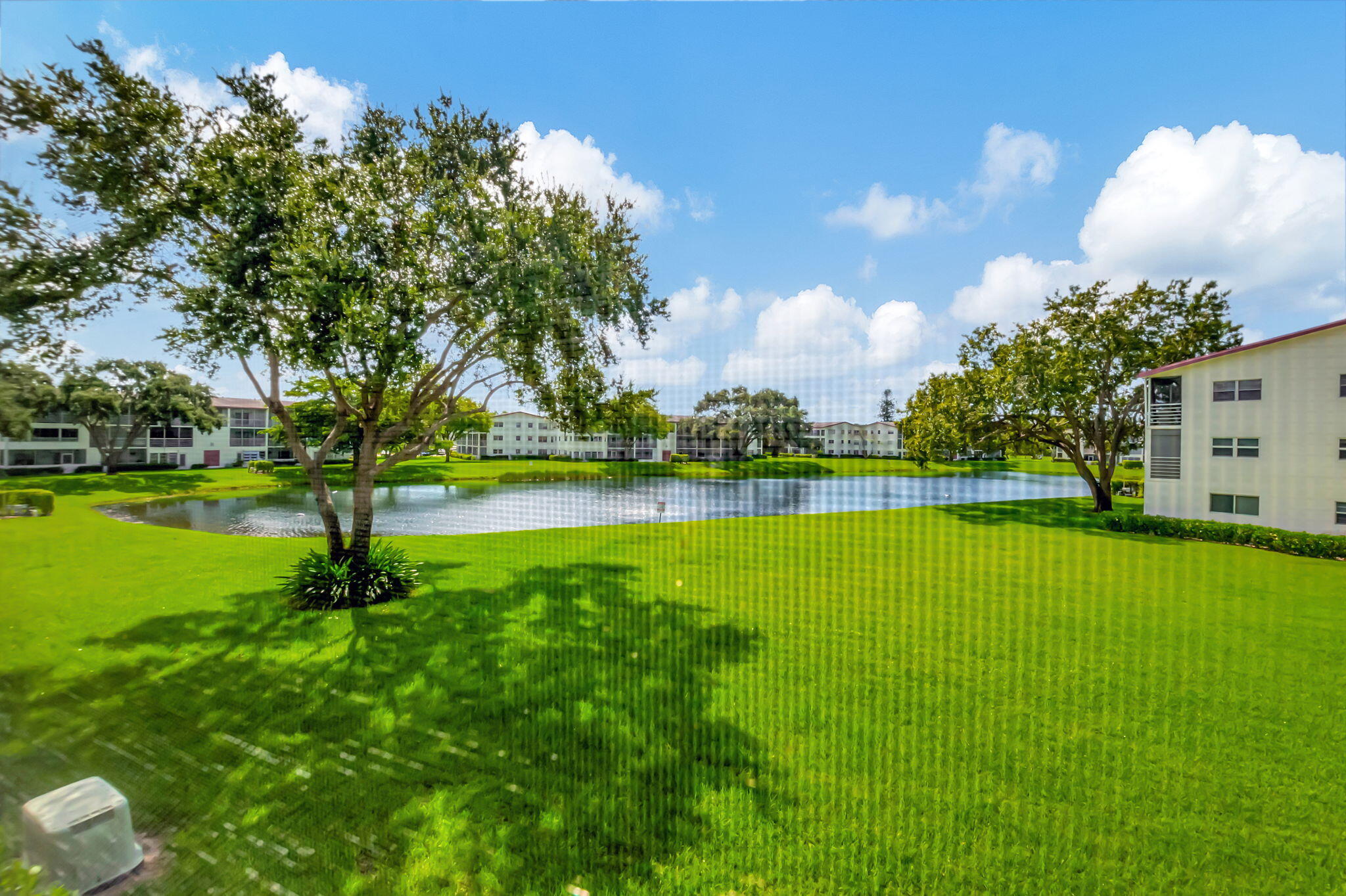28 Fanshaw A Boca Raton, FL 33434 - Photo 20 of 63 a view of a lake with a big yard