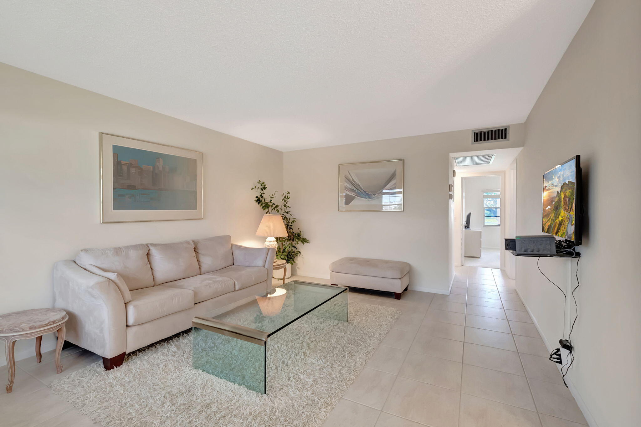 28 Fanshaw A Boca Raton, FL 33434 - Photo 3 of 63 a living room with furniture and wooden floor