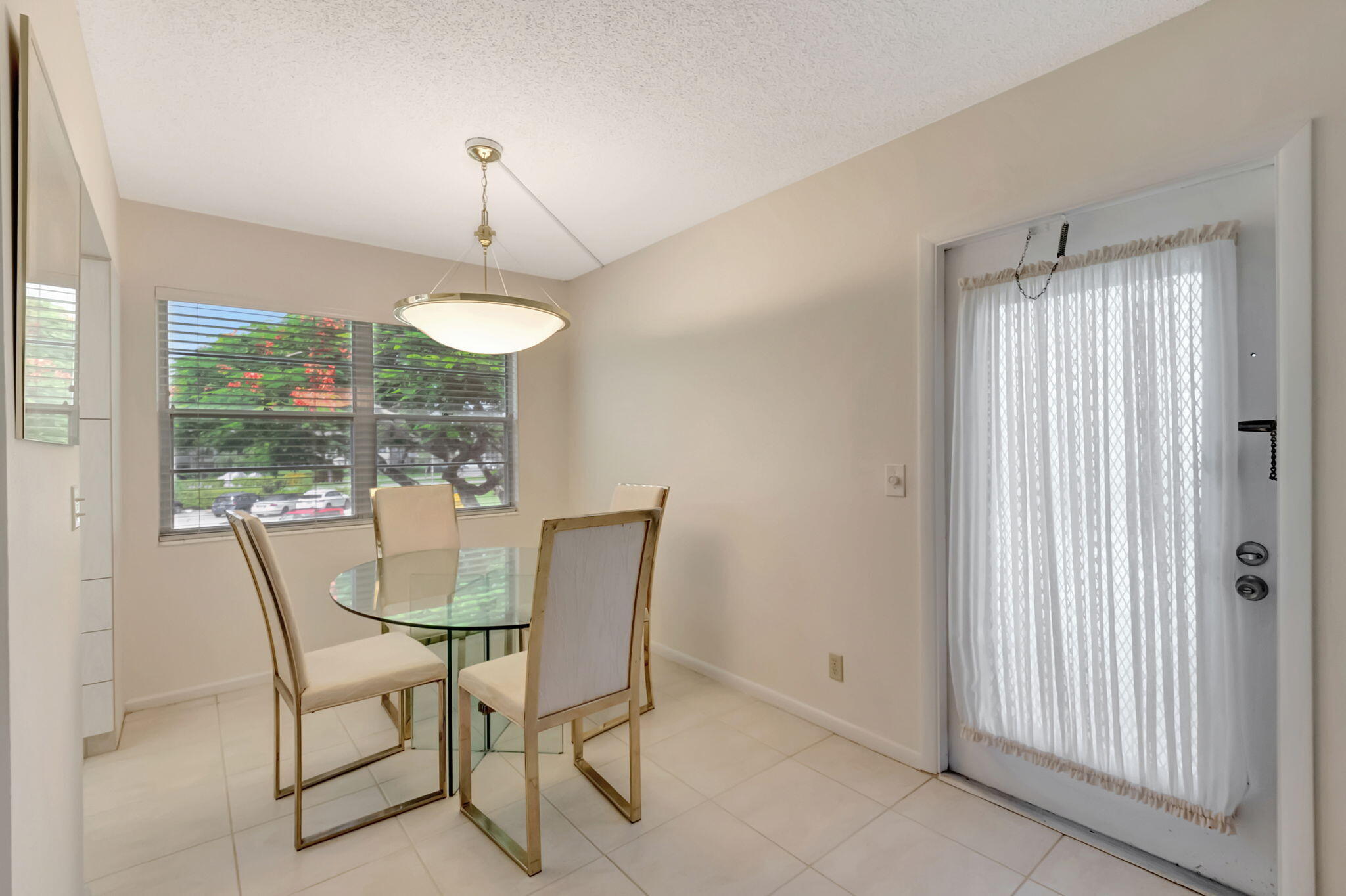 28 Fanshaw A Boca Raton, FL 33434 - Photo 4 of 63 a view of a dining room with furniture wooden floor and chandelier
