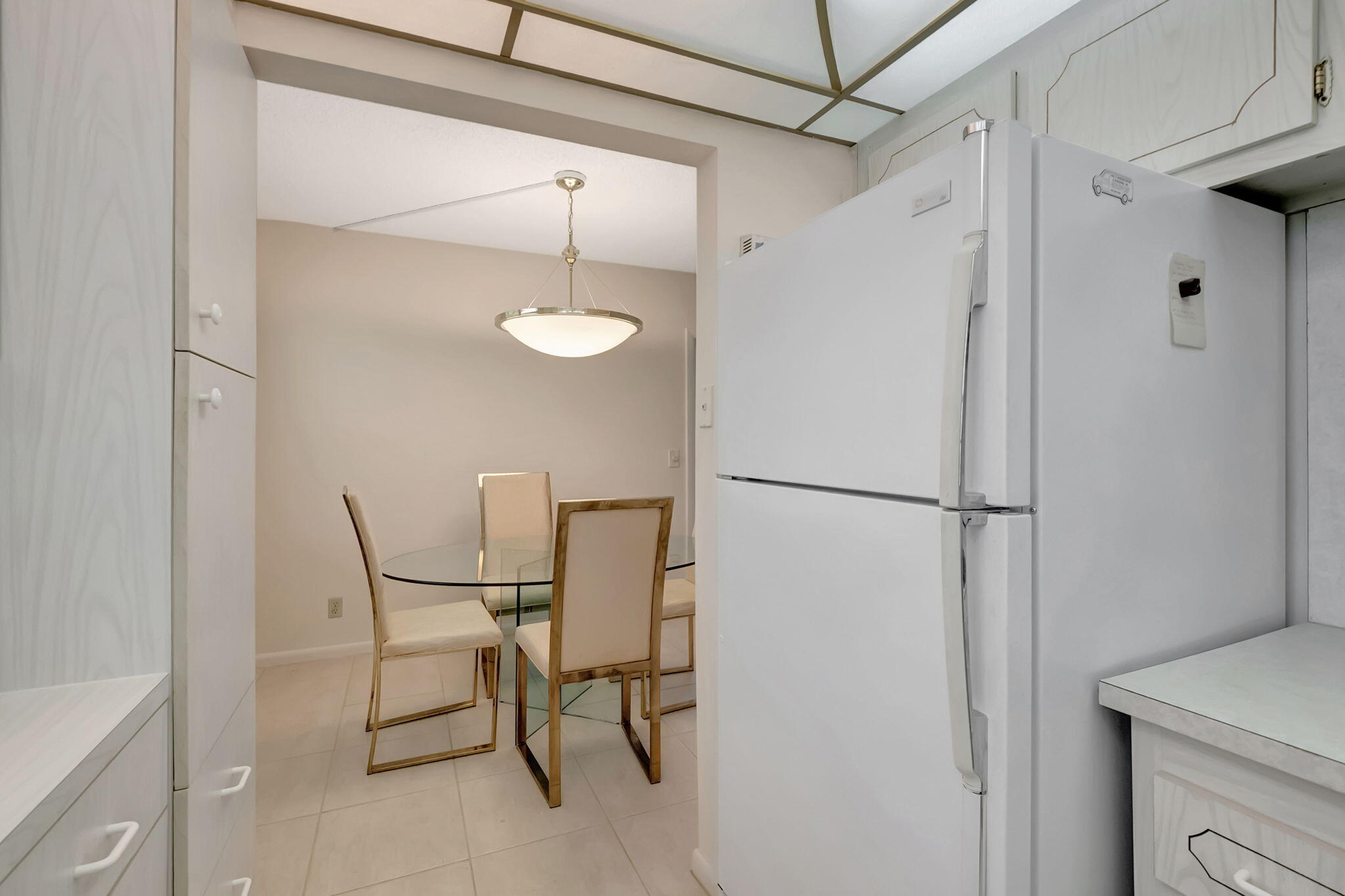 28 Fanshaw A Boca Raton, FL 33434 - Photo 10 of 63 a view of a room with table and chairs