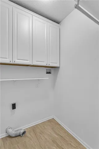 a living room with furniture fireplace and window