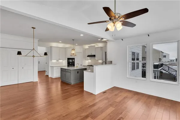 a view of kitchen with cabinets and wooden floor