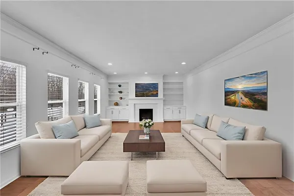 a living room with furniture fireplace and window