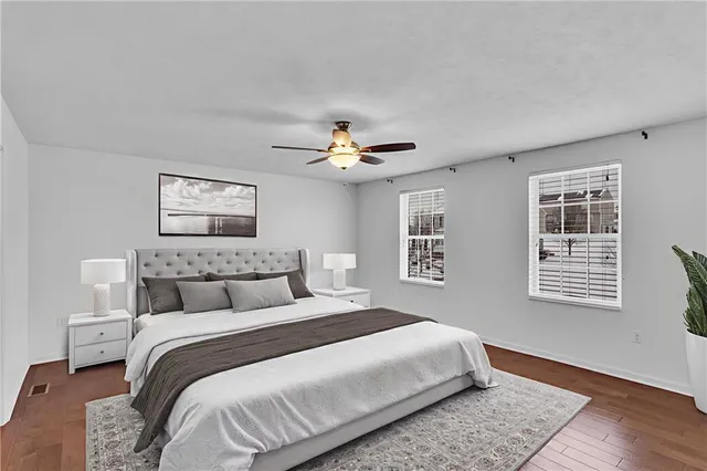 a view of a house with a backyard and sitting area