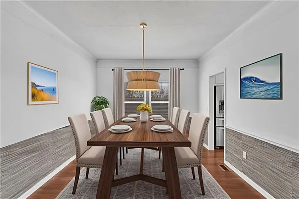 a view of a dining room with furniture window and wooden floor