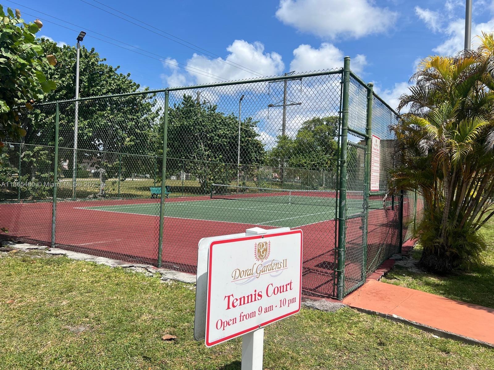 4810 Northwest 79th Avenue, Unit 305 Doral, FL 33166 - Photo 22 of 28 a sign board with yard in the back