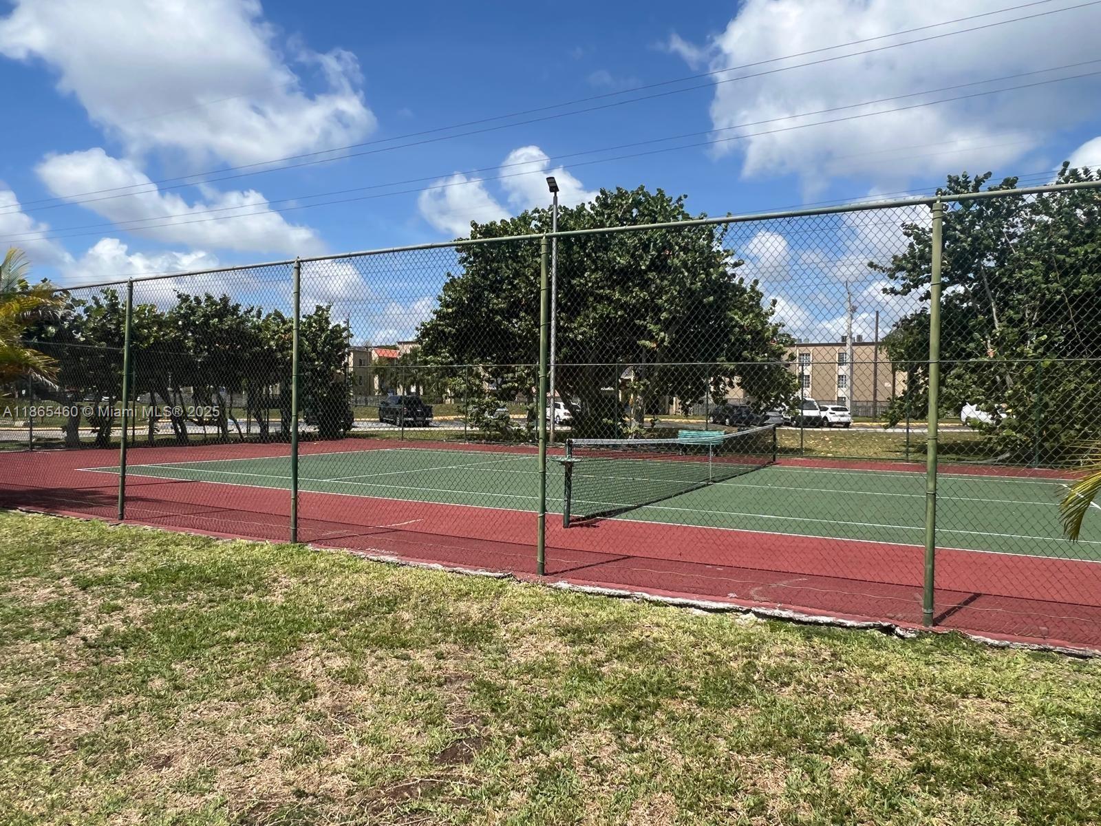 4810 Northwest 79th Avenue, Unit 305 Doral, FL 33166 - Photo 23 of 28 a view of a tennis court