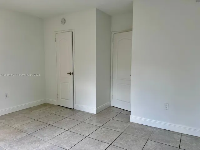 an empty room with a bathroom