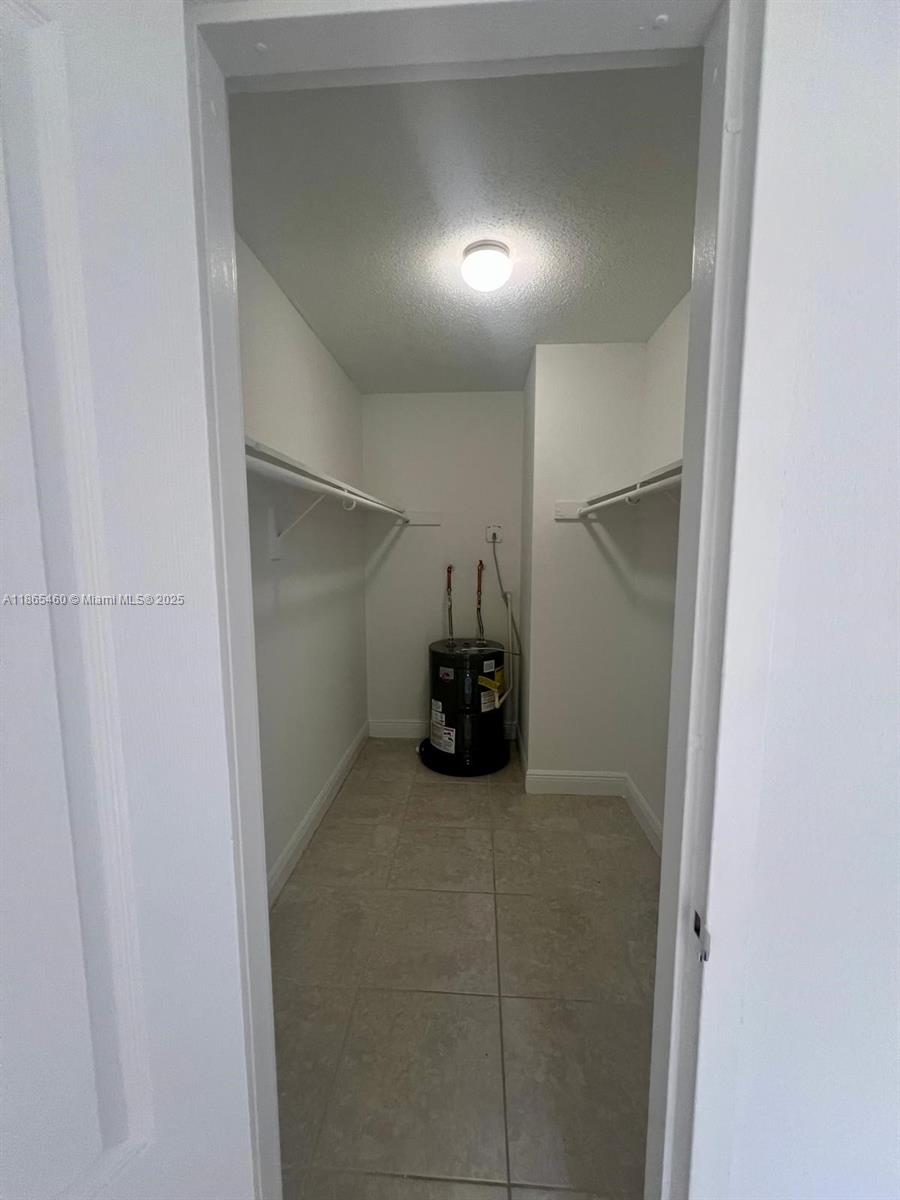 4810 Northwest 79th Avenue, Unit 305 Doral, FL 33166 - Photo 10 of 28 a view of empty room with a fireplace