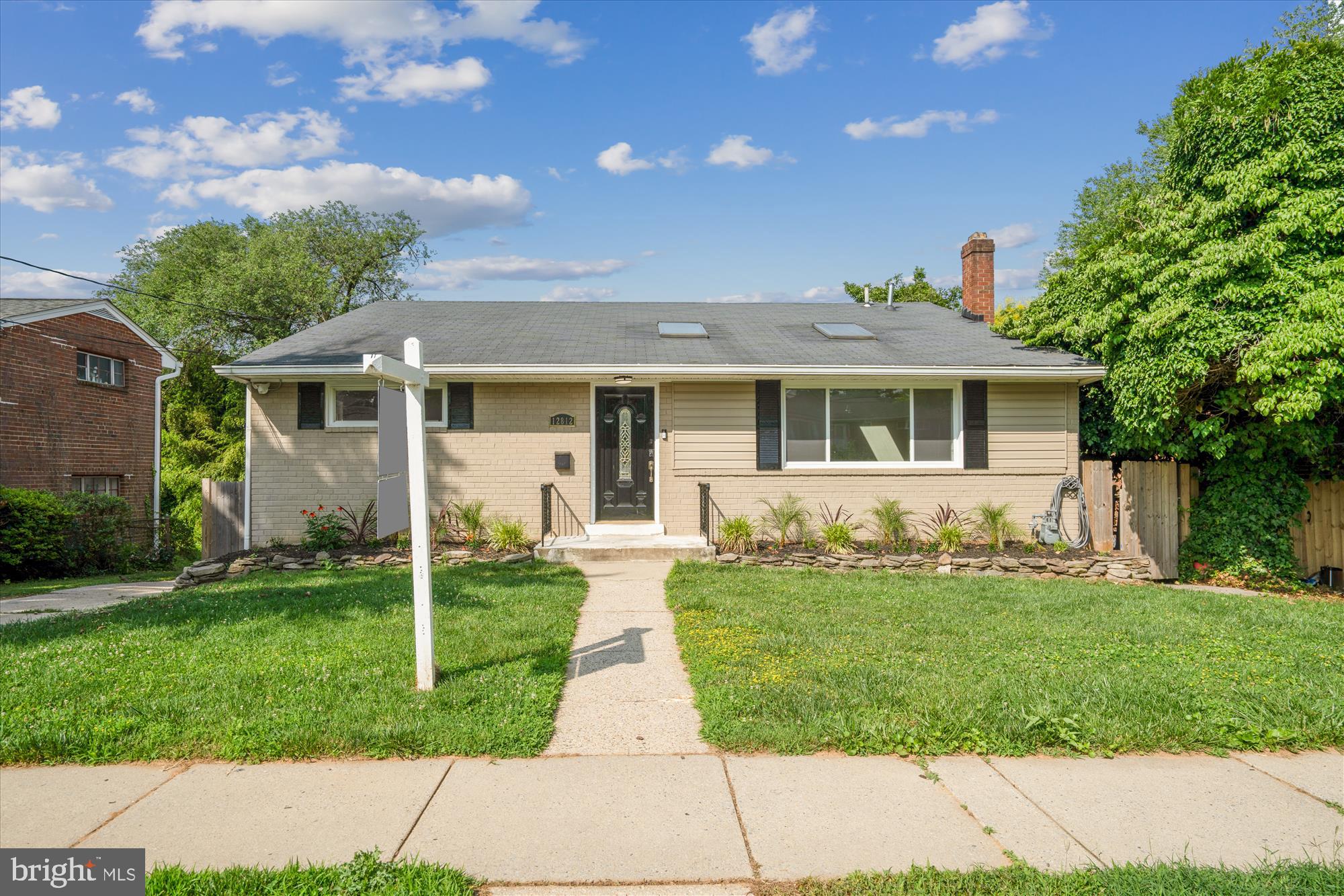 front view of a house with a yard