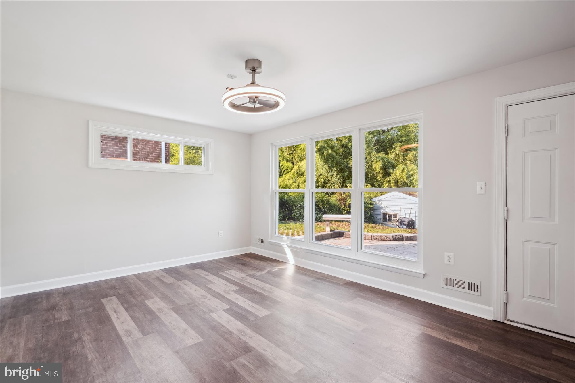 12812 Crisfield Road Silver Spring, MD 20906 - Photo 13 of 83 an empty room with wooden floor and windows