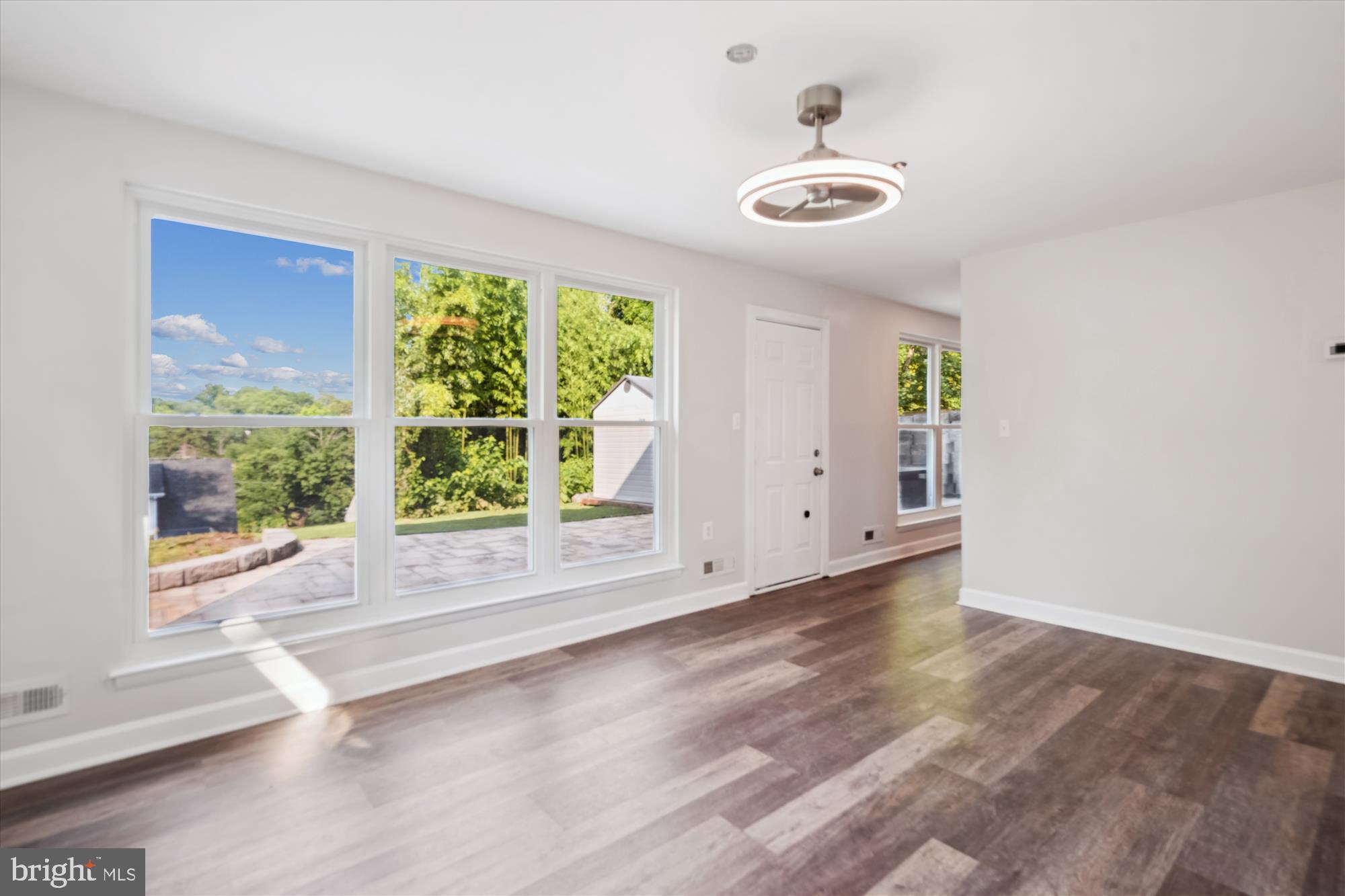 12812 Crisfield Road Silver Spring, MD 20906 - Photo 14 of 83 a view of an empty room with wooden floor and a window