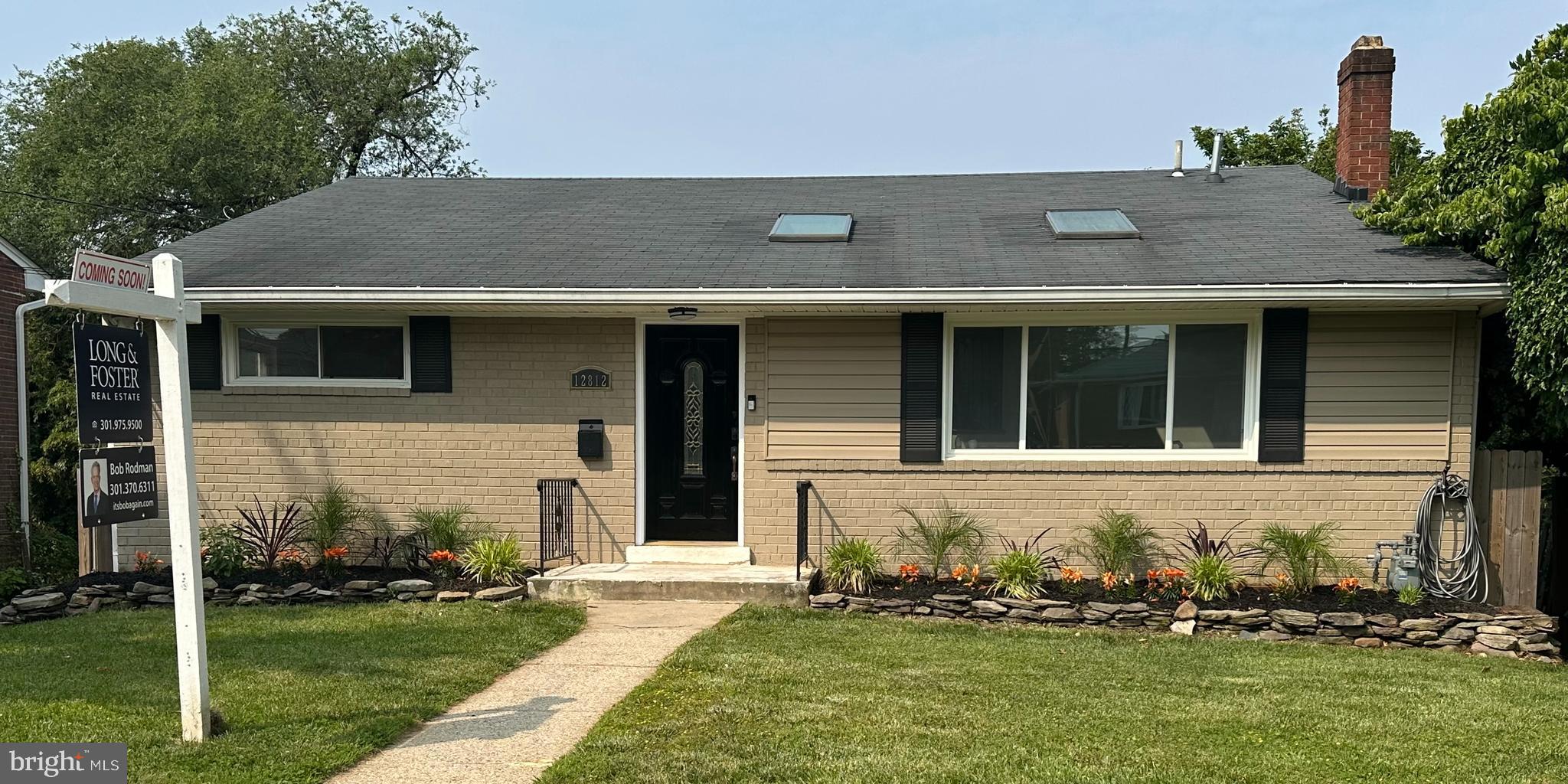12812 Crisfield Road Silver Spring, MD 20906 - Photo 2 of 83 a front view of a house with a yard