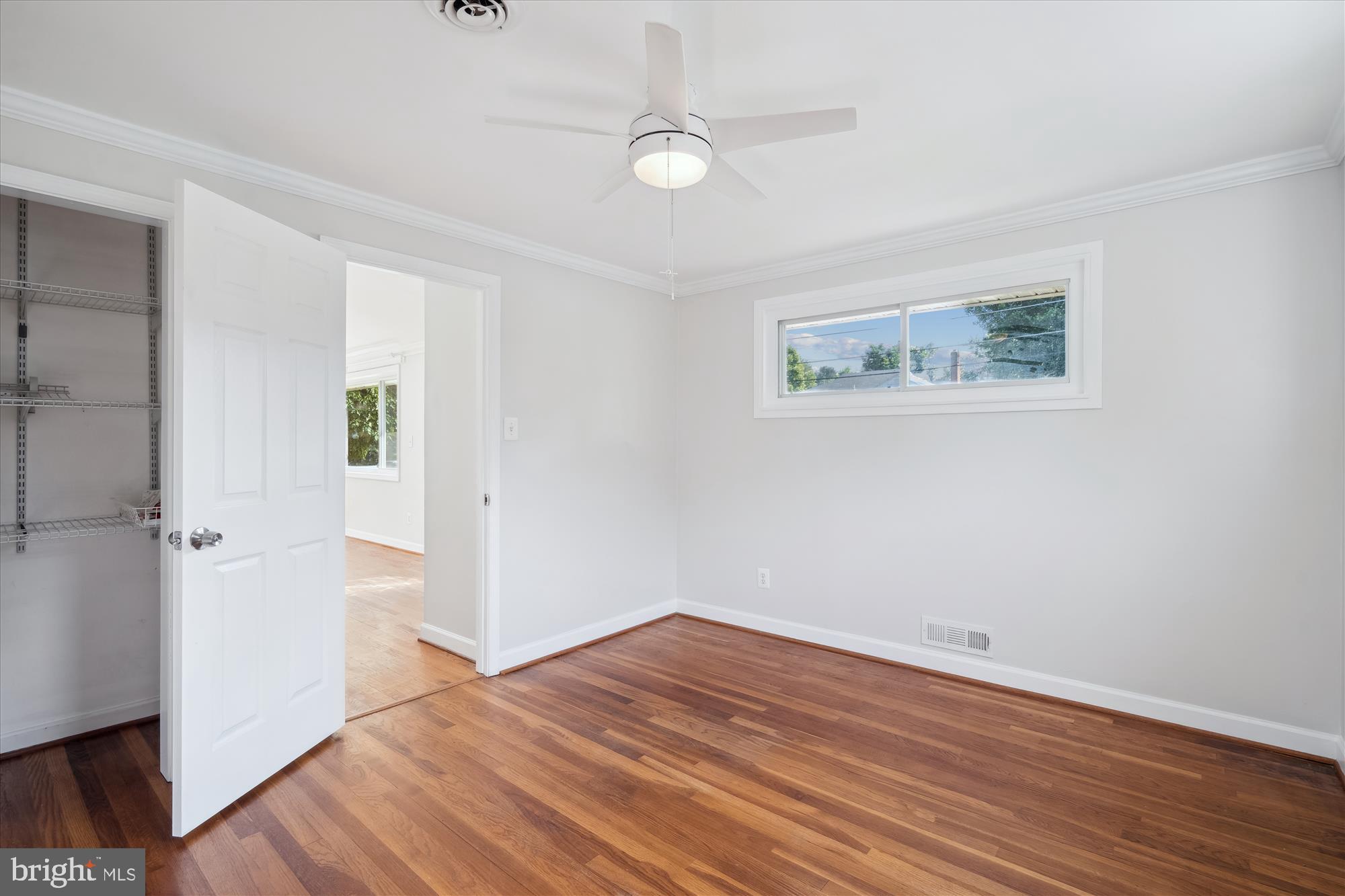 12812 Crisfield Road Silver Spring, MD 20906 - Photo 31 of 83 an empty room with wooden floor and windows