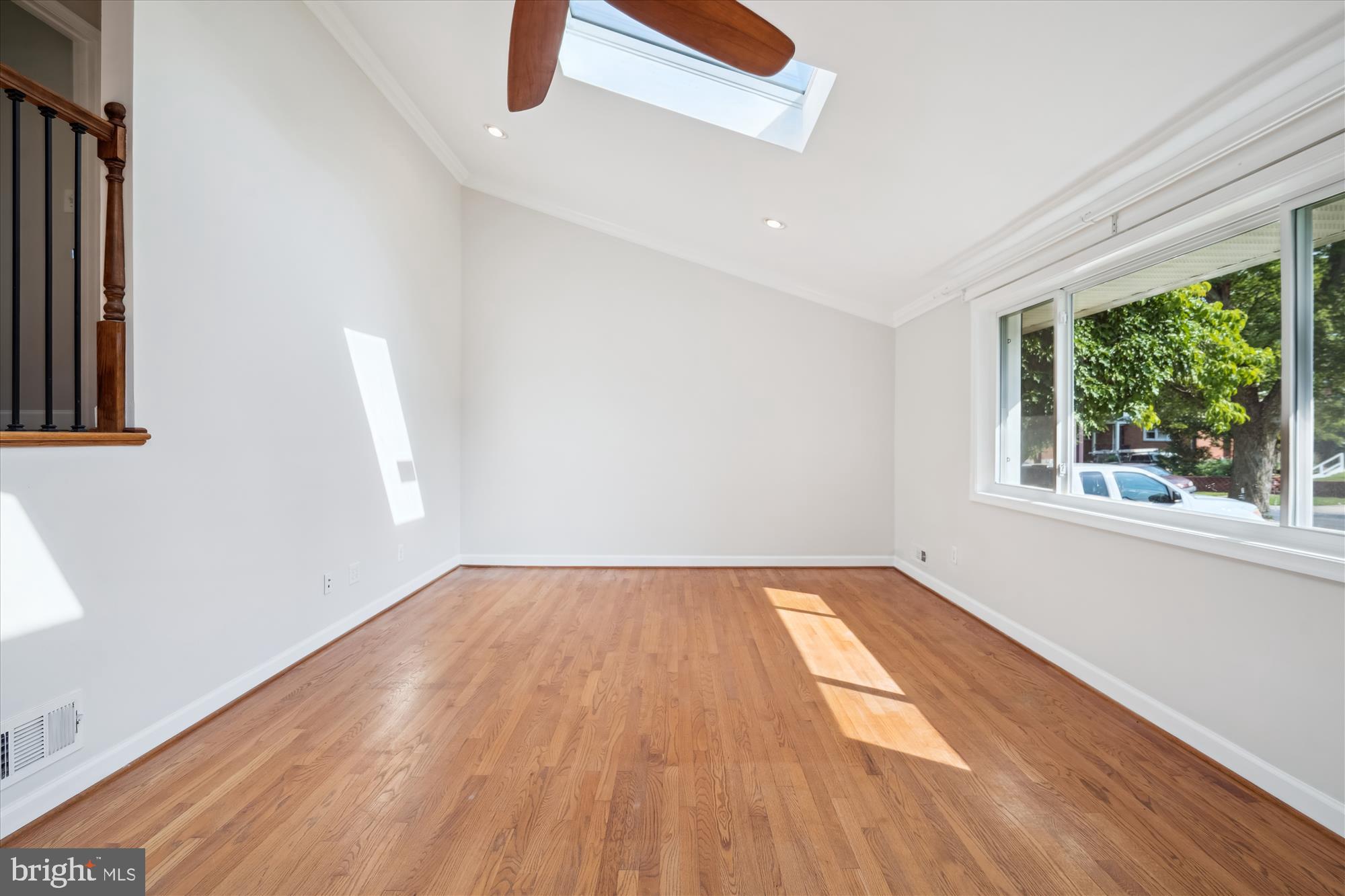 12812 Crisfield Road Silver Spring, MD 20906 - Photo 34 of 83 an empty room with wooden floor and windows